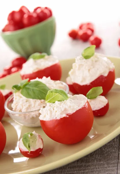 Appetizer, tomato stuffed with cheese — Stock Photo, Image