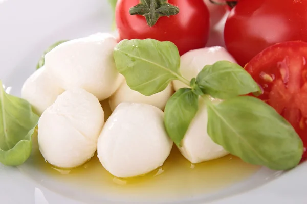 Mozzarella and basil with tomato — Stock Photo, Image