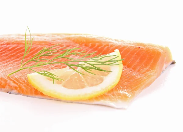 Raw salmon slice and lemon — Stock Photo, Image