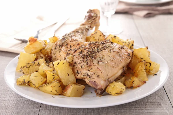 stock image Grilled chicken leg and potato