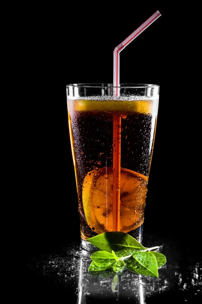 Fresh cola drink with limes. Isolated on black background — Stock Photo, Image