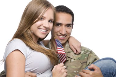 Military Man has Happy Wife in His Arm clipart