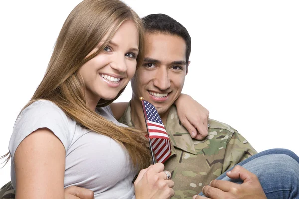 Militærmannen har Happy Wife i sin favn – stockfoto