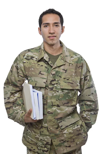 Latino militærmann med skolebøker stockfoto