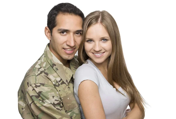 Gelukkige militaire paar omhelzing Rechtenvrije Stockfoto's