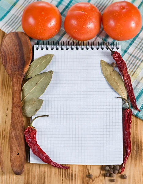 Open notebook with vegetables — Stock Photo, Image
