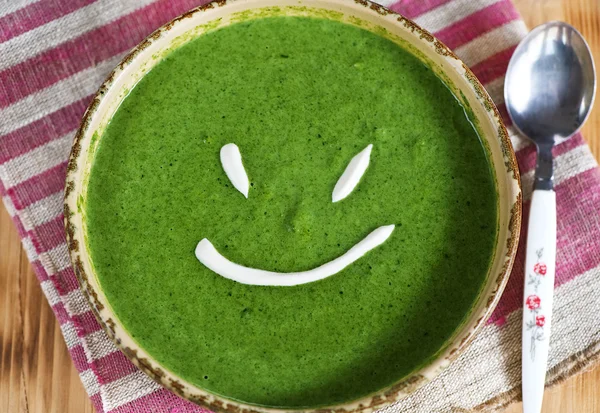 Spinach cream soup smile — Stock Photo, Image