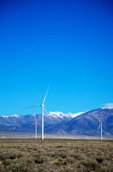 Power mills field in front of the mountain range — Stock Photo, Image