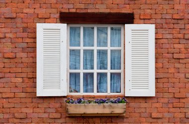 Vintage window on red brick wall clipart