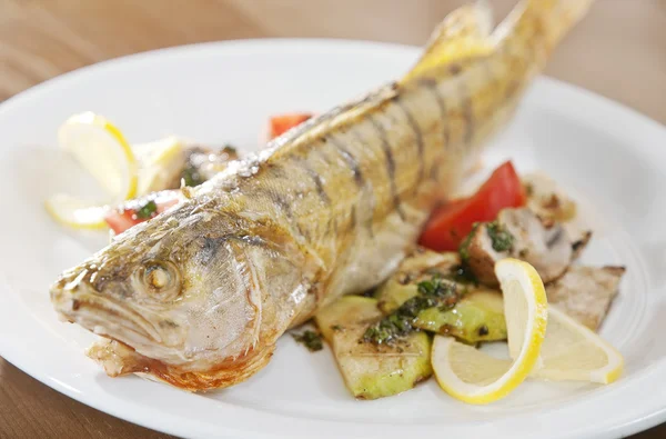 stock image Grilled fish with potato and lime