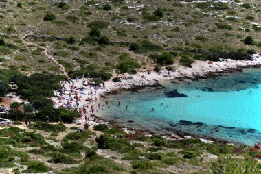 Beach on Kornati island with lots of tourist clipart