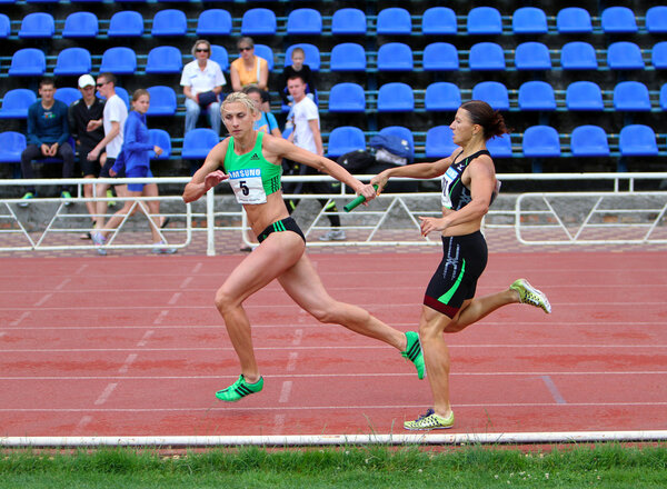 Antonina Efremova and Olishevska Yulia compete at the relay race on Ukrainian Cup in Athletics, on May 29, 2012 in Yalta, Ukraine