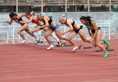 Sinista Ina, Kuzminok Oksana, Mohnuk Nastia, Fedorova Alina, Melnichenko Anna compete in heptathlon on Ukrainian Cup in Athletics on May 28, 2012 in Yalta, Ukraine. clipart