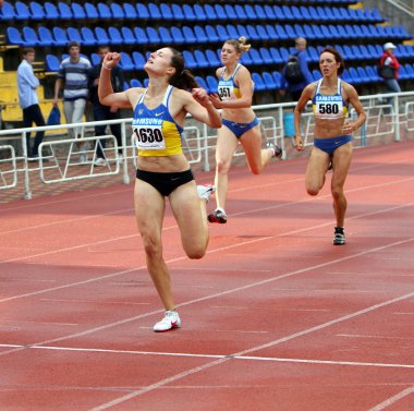 YALTA, UKRAINE - JUNE 01:(L-R) Kolesnichenko Olena, Slusarenko Katerina, Lebed Anastasia compete in the 400 meters race clipart