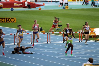 BARCELONA, SPAIN - JULY 14: athletes compete in the 400 meters hurdles final on the 2012 IAAF World Junior Athletics Championships on July 14, 2012 in Barcelona, Spain. clipart