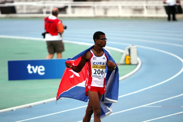Yordan L. O'Farrill from Cuba celebrates winning of the 110 meters hurdles final on the 2012 IAAF World Junior Athletics Championships on July 12, 2012 in Barcelona, — Stock Photo, Image