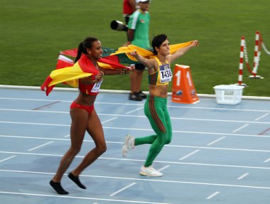 Ana Peleteiro and Dovilé Dzindzaletaité celebrate the gold and silver medal in triple jump on 2012 World Junior Athletics Championships on July 12, 2012 in Barcelona, Spain