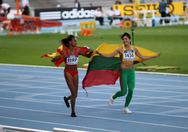 Ana Peleteiro and Dovilé Dzindzaletaité celebrate the gold and silver medal in triple jump on 2012 World Junior Athletics Championships on July 12, 2012 in Barcelona, Spain