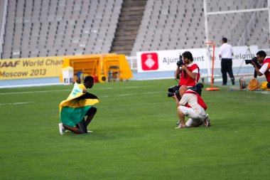 Fedrick Dacres from Jamaica celebrates gold medal in discus throw event on the 2012 IAAF World Junior Athletics Championships on July 12, 2012 in Barcelona, Spain. clipart