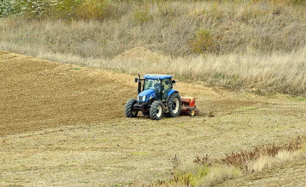 stock image Tractor plowing land