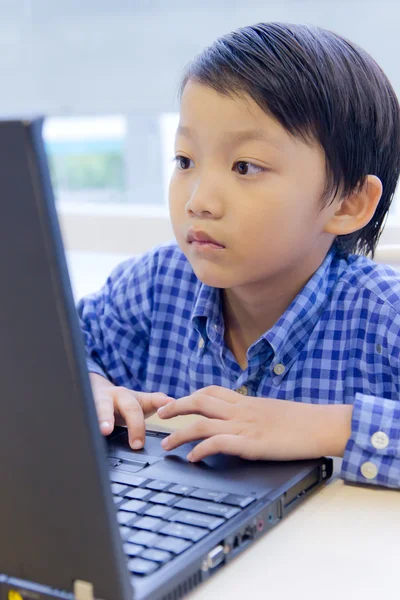 stock image Asian kid with laptop notebook