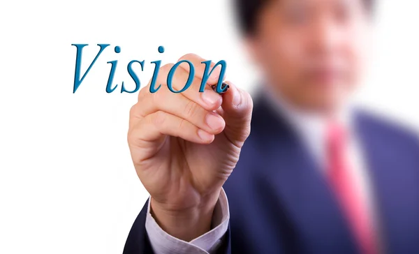 Business man writing vision word — Stockfoto