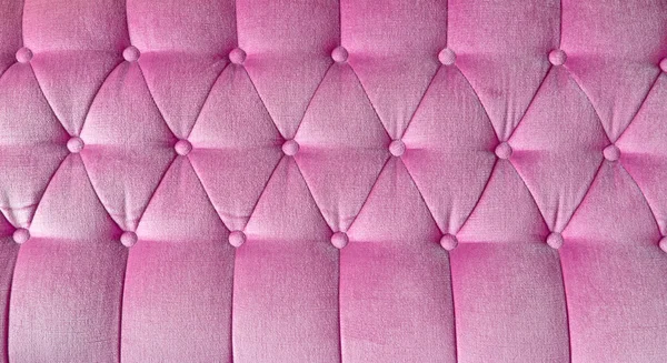 纹理的背景为粉红色布艺沙发 — 图库照片