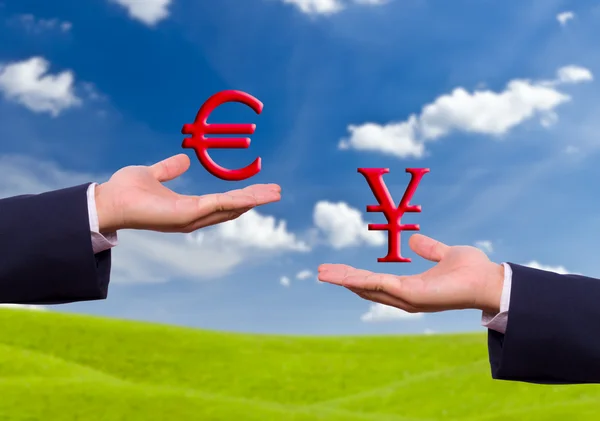 Hand exchange euro and yen sign — Stock Photo, Image