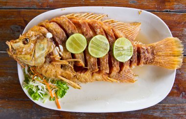 Fired fish with fishsauce delicious thai food clipart