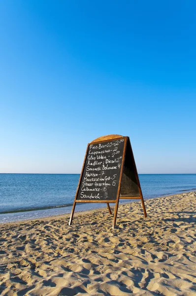 Menu board on the beach — Stock Photo, Image