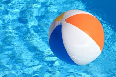 Summer background. Beach Ball on the swimming Pool clipart
