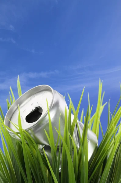 stock image Recycle concept. Drink can on green grass