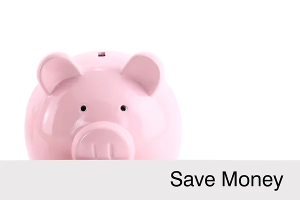Piggy bank hiding behind a banner isolated on white — Stock Photo, Image