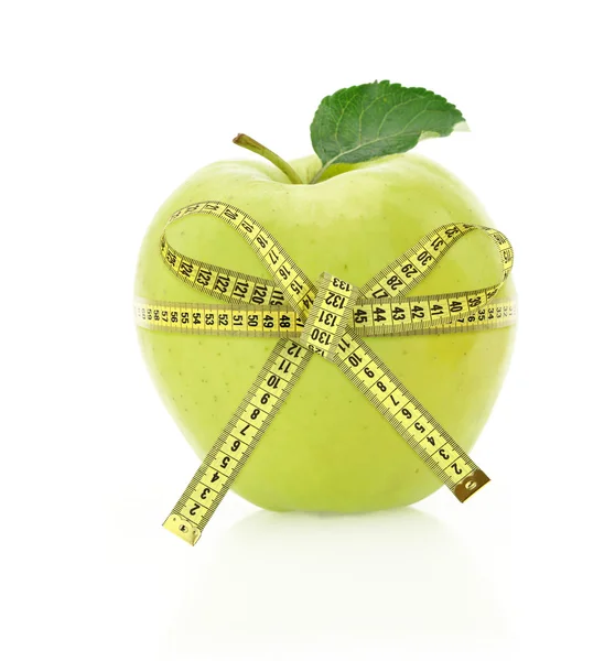 Il concetto di dieta. mela con nastro di misura — Foto Stock