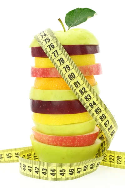 Pojęcie diety. owoce z taśma miernicza — Zdjęcie stockowe