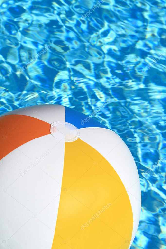 Summer background. Beach Ball on the swimming Pool