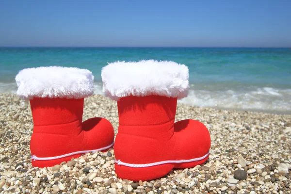 Santa Claus boots on the beach — Stock Photo, Image