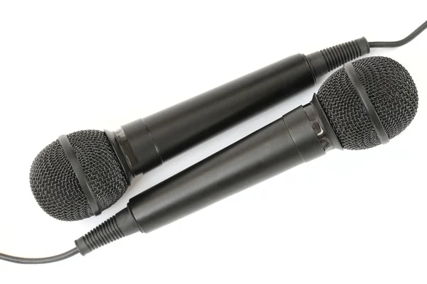 Dos micrófonos sobre fondo blanco- var. 2. Imágenes de stock libres de derechos
