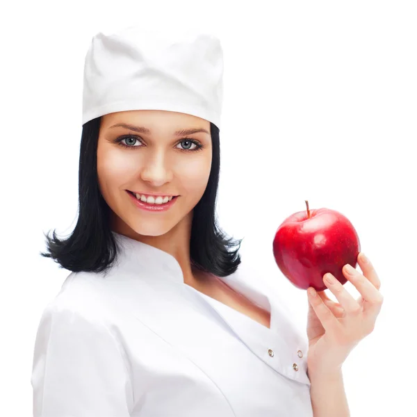Beyaz ba izole Kırmızı elma tutan bir kadın doktor — Stok fotoğraf