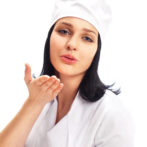 Professional Cook with plate of fruits sending an air kiss, isol — Stock Photo, Image