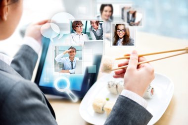 Young business woman having a business lunch at cafe with free w clipart