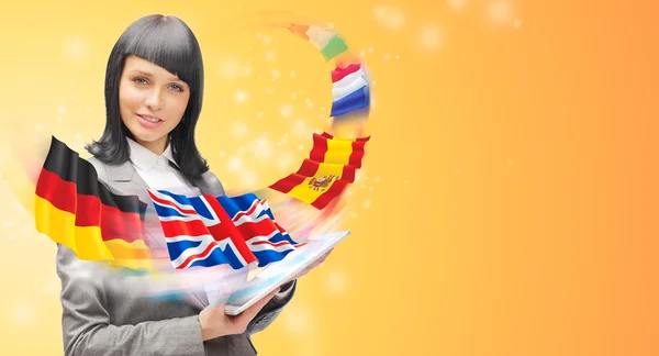 Young woman wearing suit holding tablet computer. Flags of Europ — Stock Photo, Image