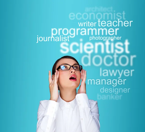 Young female student standing and thinking what profession to ch — Stock Photo, Image