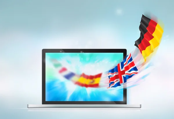Открытый ноутбук с европейскими флагами, вылетающими с экрана — стоковое фото