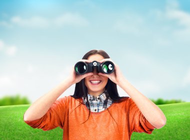 Woman looking through binoculars at summer park clipart