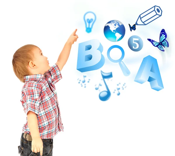 Happy little boy pointing up. Icons of different lessons flying near him. Primary education — Stock Photo, Image