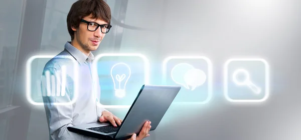 Business man holding laptop and working with virtual interface. Merge of technologies concept — Stock Photo, Image
