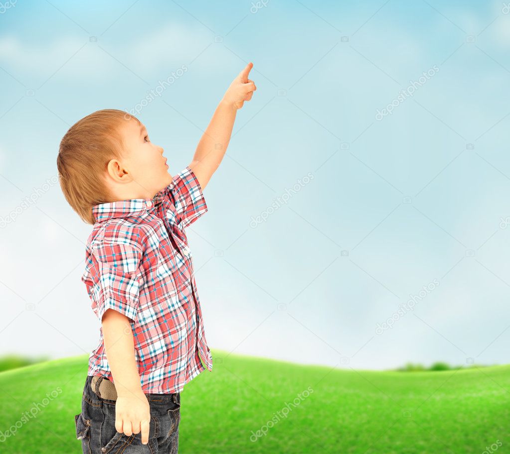 Portrait of happy joyful beautiful little boy outdoor at countryside