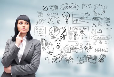 Young business woman thinking of her plans clipart