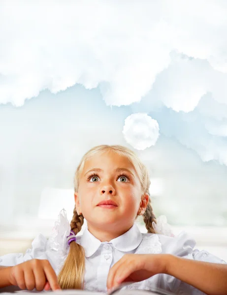 Portrait of a young girl in school at the desk. Vertical Shot. D — Stock Photo, Image